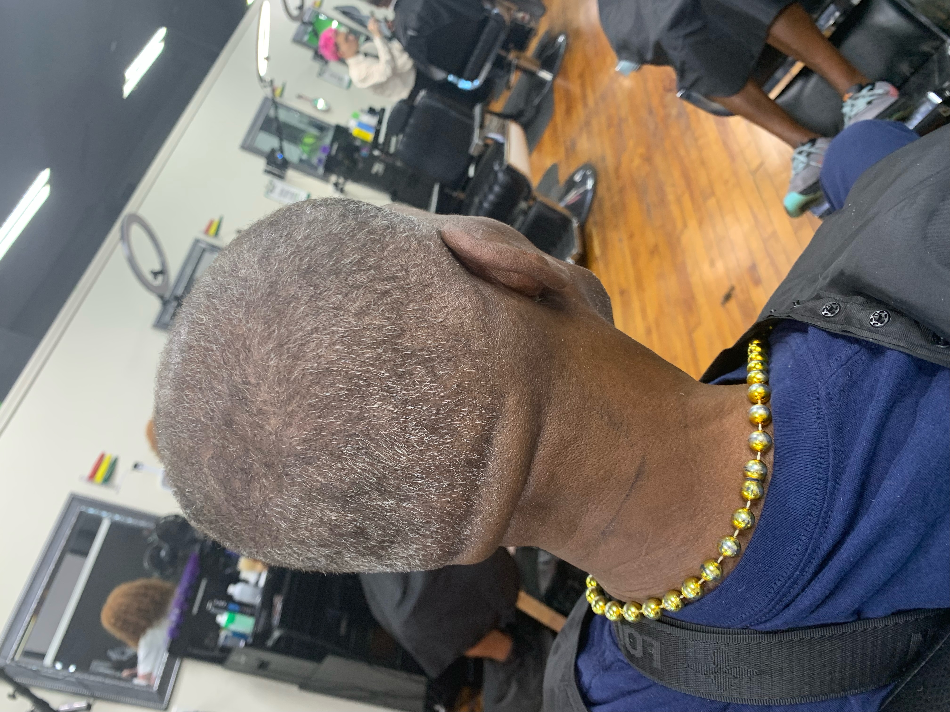 Fresh cut showcasing our barbershop environment